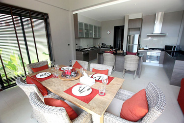 Dining and Kitchen Area with Garden and Pool View
